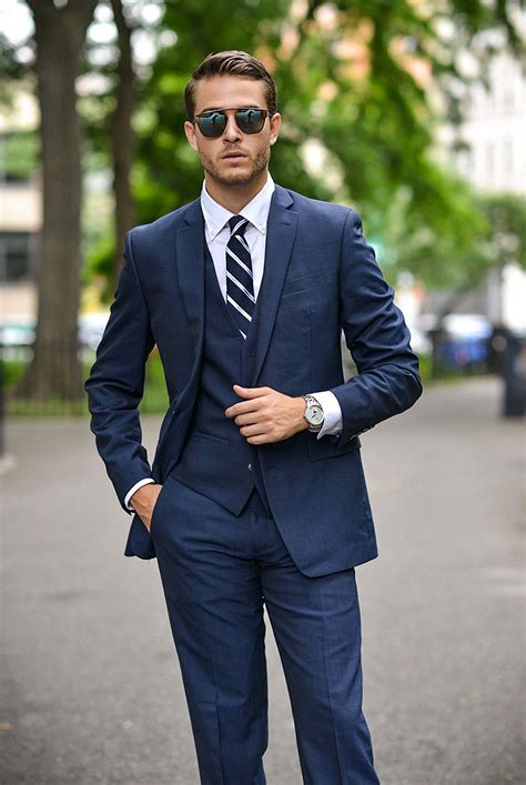 navy suit with white tie.